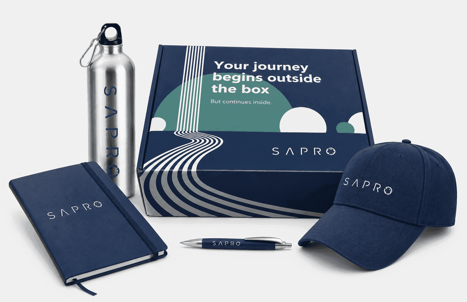 Sapro Your Journey Begins Outside the Box onboarding kit with branded bottle, cap, journal, and pen